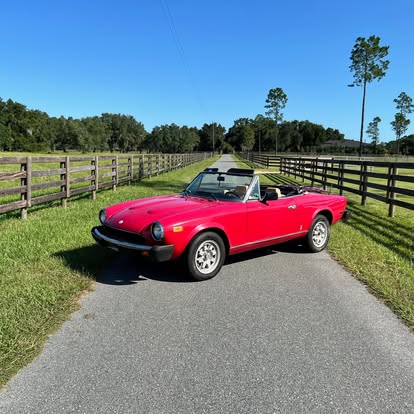 Fully restored red Fiat 124 Sport Spider by Italian Performance Restoration